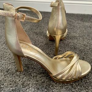 Gold high heels.